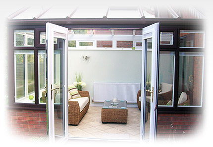 A photo of a man reclining next to a composite patio door